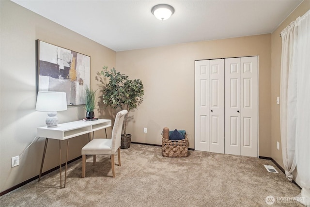 home office with visible vents, baseboards, and carpet flooring