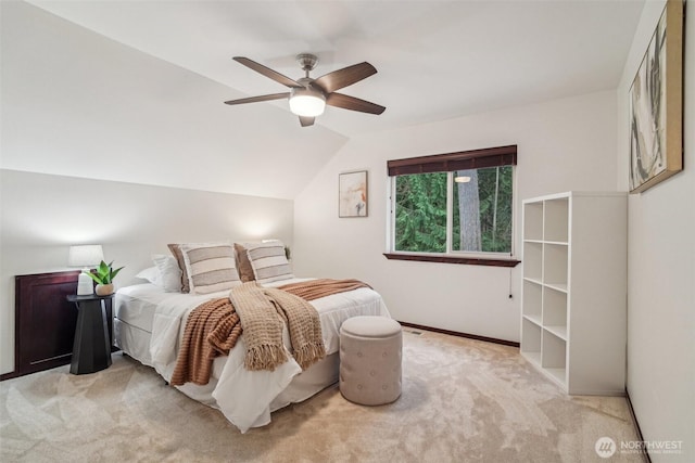 bedroom featuring ceiling fan, baseboards, lofted ceiling, and carpet