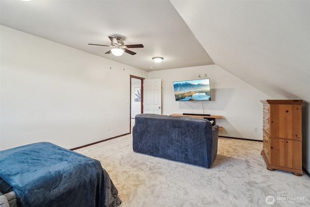 bedroom with baseboards, light carpet, ceiling fan, and vaulted ceiling