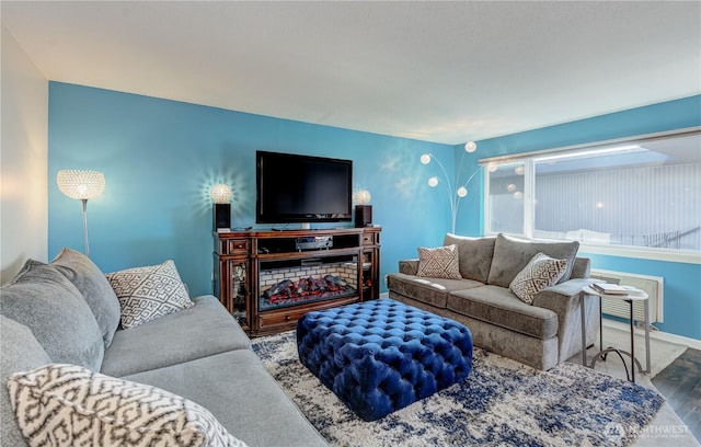 living area featuring baseboards