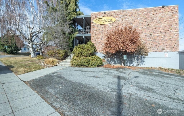 view of property exterior featuring stairs