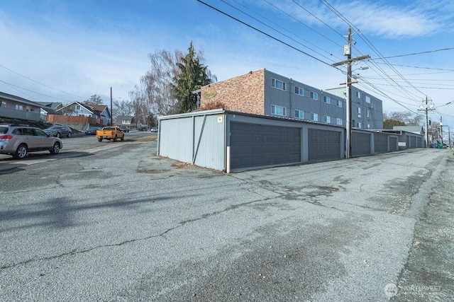 view of street featuring community garages