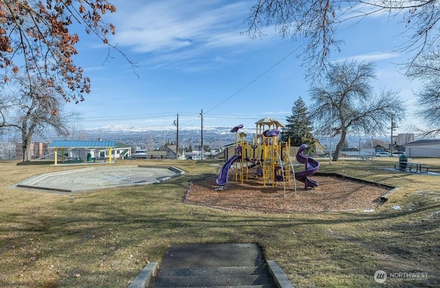 communal playground featuring a lawn