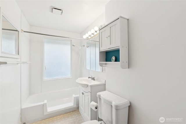 full bathroom with vanity, toilet, and  shower combination