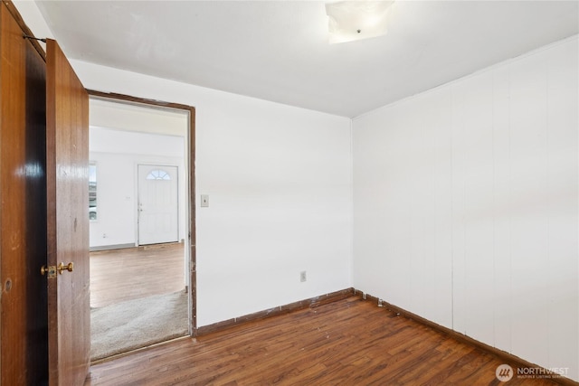 spare room with hardwood / wood-style flooring