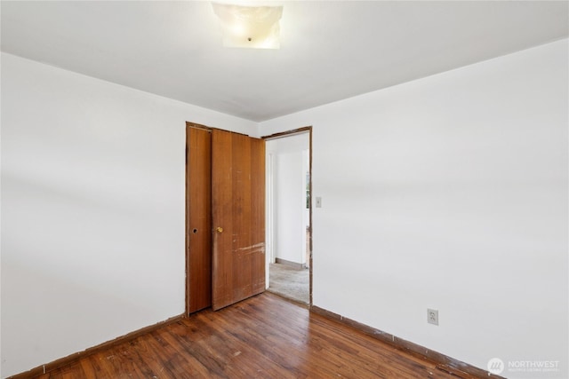 spare room featuring dark hardwood / wood-style floors