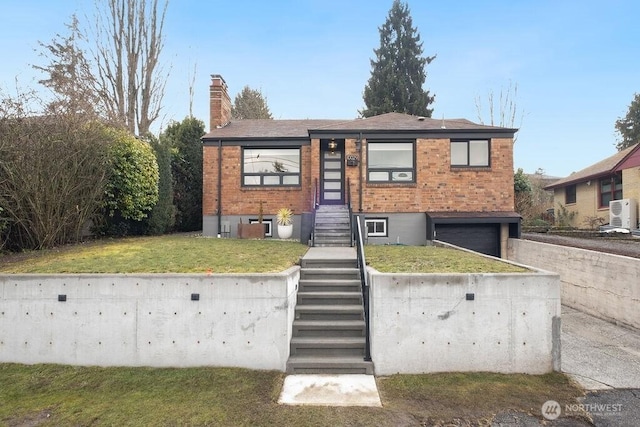 view of front facade with a front lawn and a garage