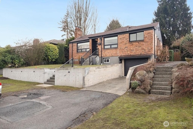 view of front of property with a front lawn and a garage