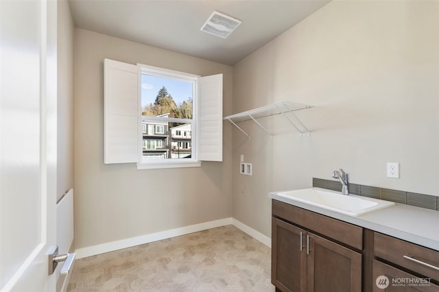 laundry area featuring hookup for a washing machine and sink