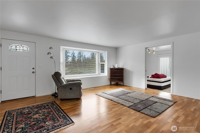 9901 S 232nd St, Kent, WA 98031 - foyer with hardwood / wood-style floors and a healthy amount of sunlight