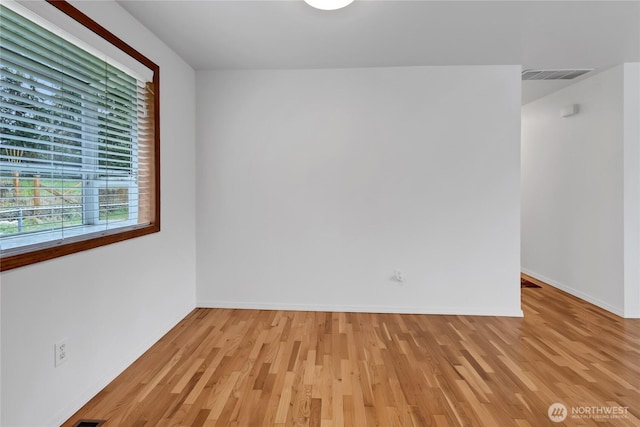 9901 S 232nd St, Kent, WA 98031 - empty room featuring light hardwood / wood-style flooring