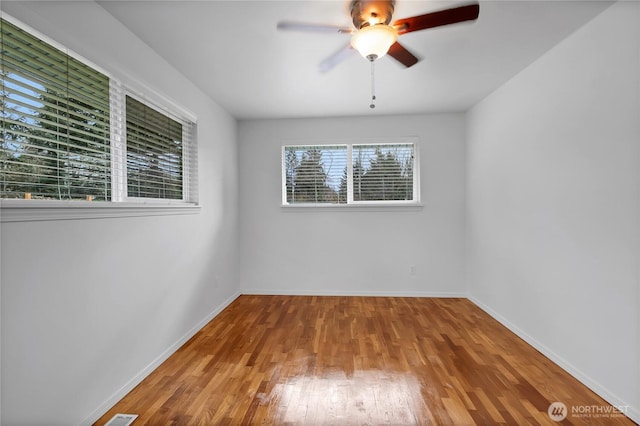 9901 S 232nd St, Kent, WA 98031 - spare room with ceiling fan and hardwood / wood-style floors