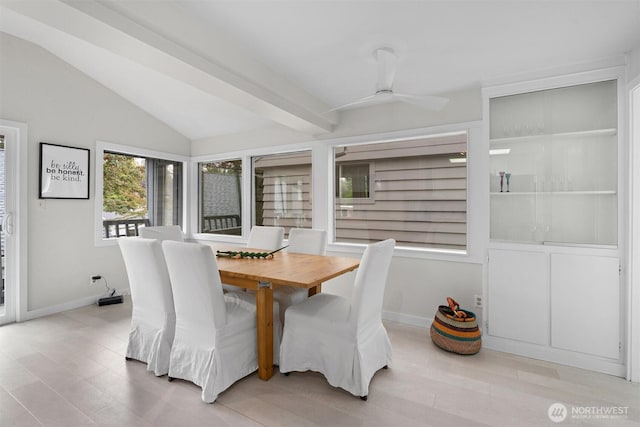 dining area featuring vaulted ceiling and ceiling fan