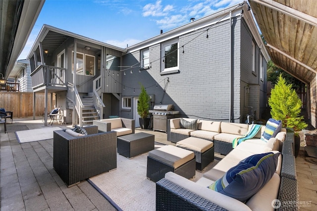 view of patio with outdoor lounge area and grilling area