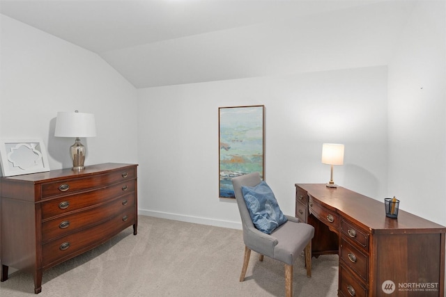 home office featuring vaulted ceiling and light carpet