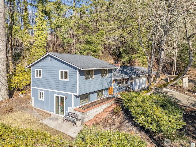 rear view of property with a patio area