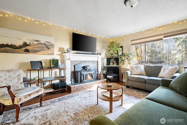 living room with hardwood / wood-style floors and a textured ceiling