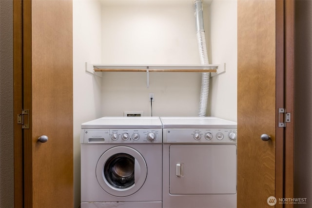 clothes washing area with laundry area and washing machine and clothes dryer