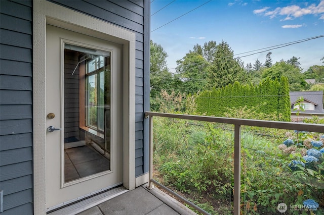 entrance to property with a balcony