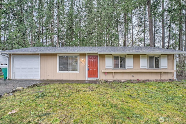 single story home with a garage, driveway, and a front lawn