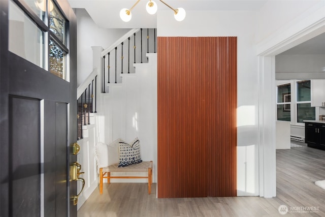 entryway with a baseboard radiator and light wood-type flooring