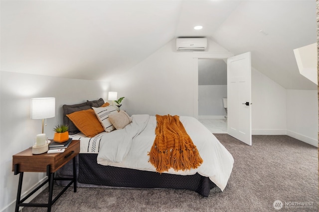 bedroom featuring vaulted ceiling, carpet floors, and a wall mounted air conditioner