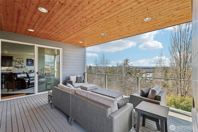 wooden terrace with outdoor lounge area