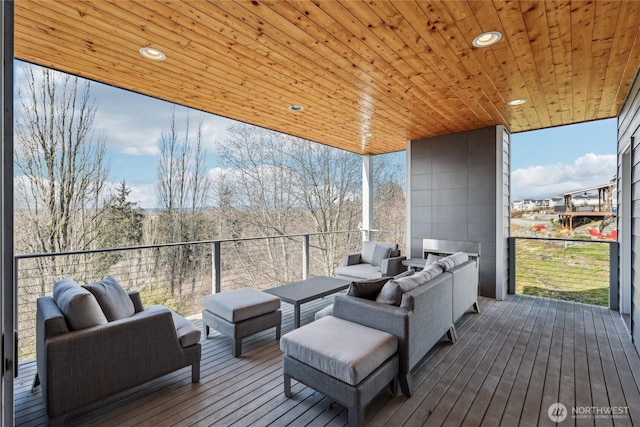 wooden deck featuring an outdoor hangout area