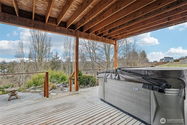 deck featuring a hot tub