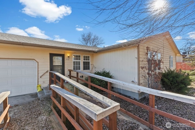 single story home featuring a garage