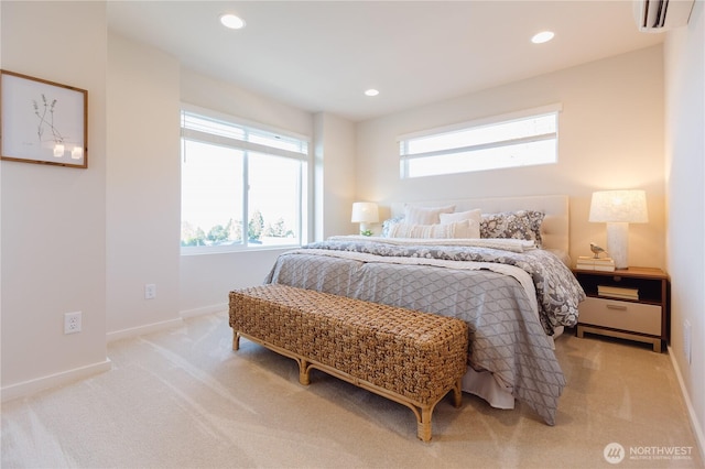 bedroom featuring light colored carpet and an AC wall unit