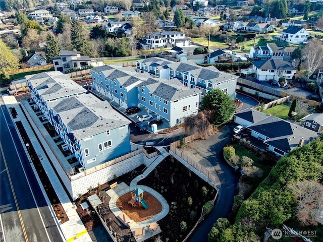 birds eye view of property with a residential view