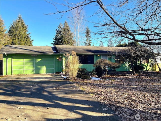 single story home with a garage