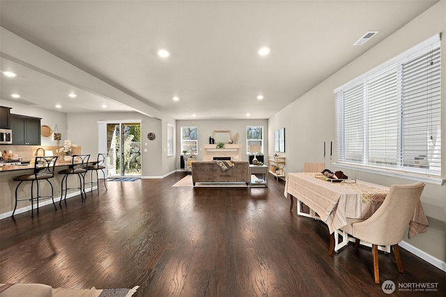 living room with dark hardwood / wood-style floors