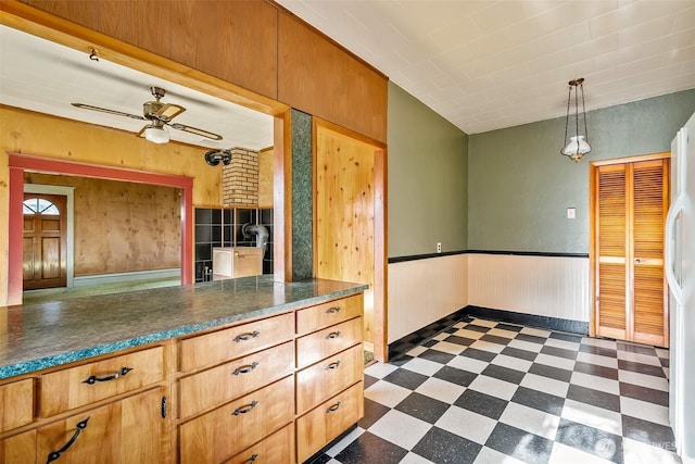 kitchen with ceiling fan and hanging light fixtures