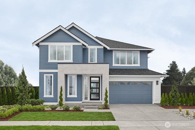 view of front of property with a garage and a front yard