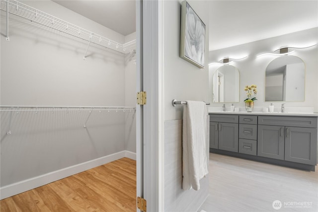 bathroom featuring vanity and wood-type flooring