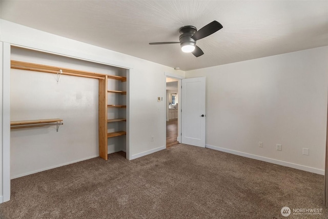 unfurnished bedroom with ceiling fan, carpet, a closet, and baseboards