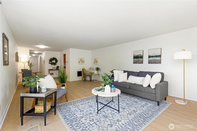 3710 25th Pl W Unit 401, Seattle, WA 98199 - living room with light wood-type flooring and baseboards