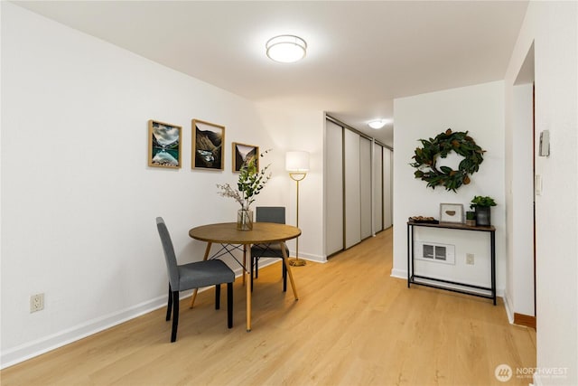 3710 25th Pl W Unit 401, Seattle, WA 98199 - dining room featuring light wood finished floors and baseboards