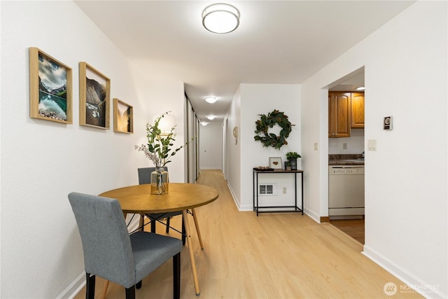3710 25th Pl W Unit 401, Seattle, WA 98199 - dining space featuring light wood finished floors and baseboards