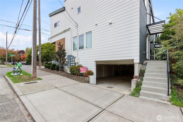 view of side of home featuring a garage