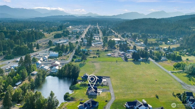 bird's eye view featuring a water and mountain view