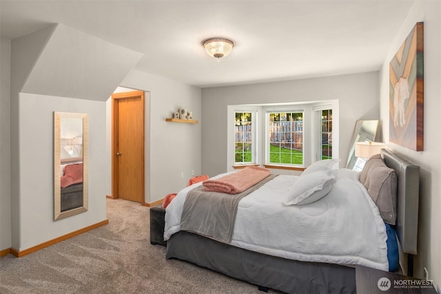 bedroom featuring baseboards and light colored carpet