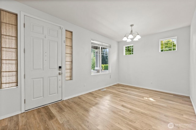 5401 Parkside Dr SE, Lacey, WA 98503 - foyer featuring a chandelier and light wood-style floors