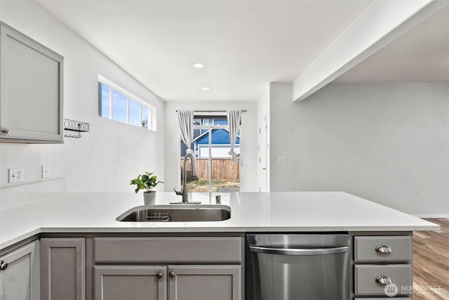 5401 Parkside Dr SE, Lacey, WA 98503 - kitchen featuring stainless steel dishwasher, gray cabinetry, wood finished floors, light countertops, and recessed lighting