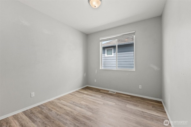 5401 Parkside Dr SE, Lacey, WA 98503 - empty room with wood finished floors and baseboards