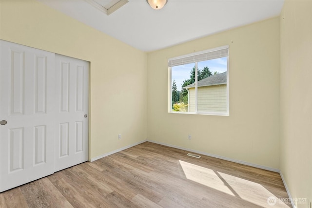 5401 Parkside Dr SE, Lacey, WA 98503 - unfurnished bedroom with wood finished floors and a closet