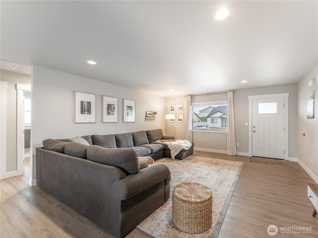 living room with light hardwood / wood-style flooring