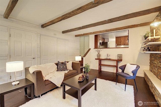 living room with hardwood / wood-style floors and beam ceiling